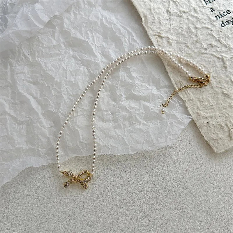 Bow Shape Pearl Korean Necklace (PQT-992)